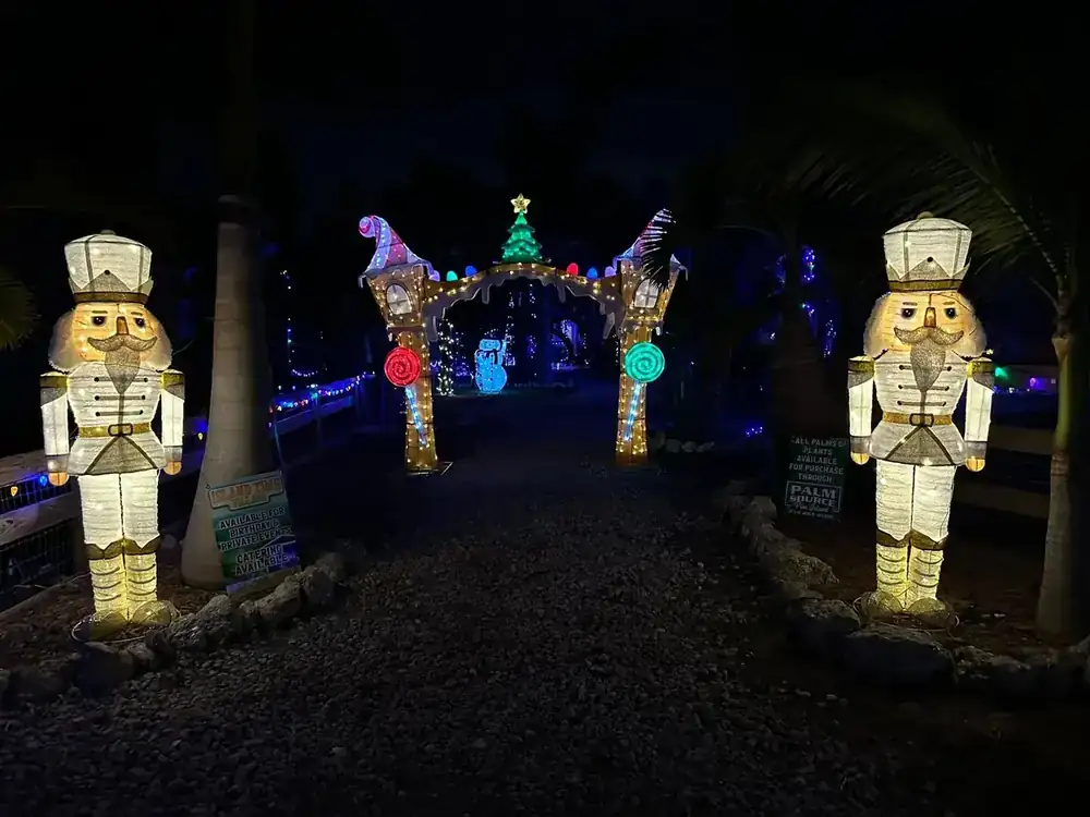Two lit nutcrackers flanking the gingerbread arch